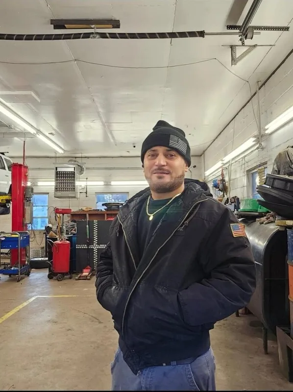 A.T., owner and lead technician at Hanover Auto Service and Sales, in the garage